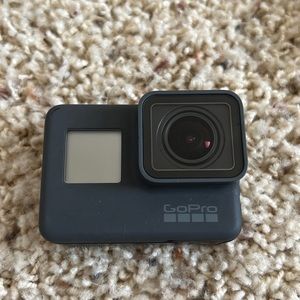 GoPro Hero 5 with charging cable as show and two batteries, head strap